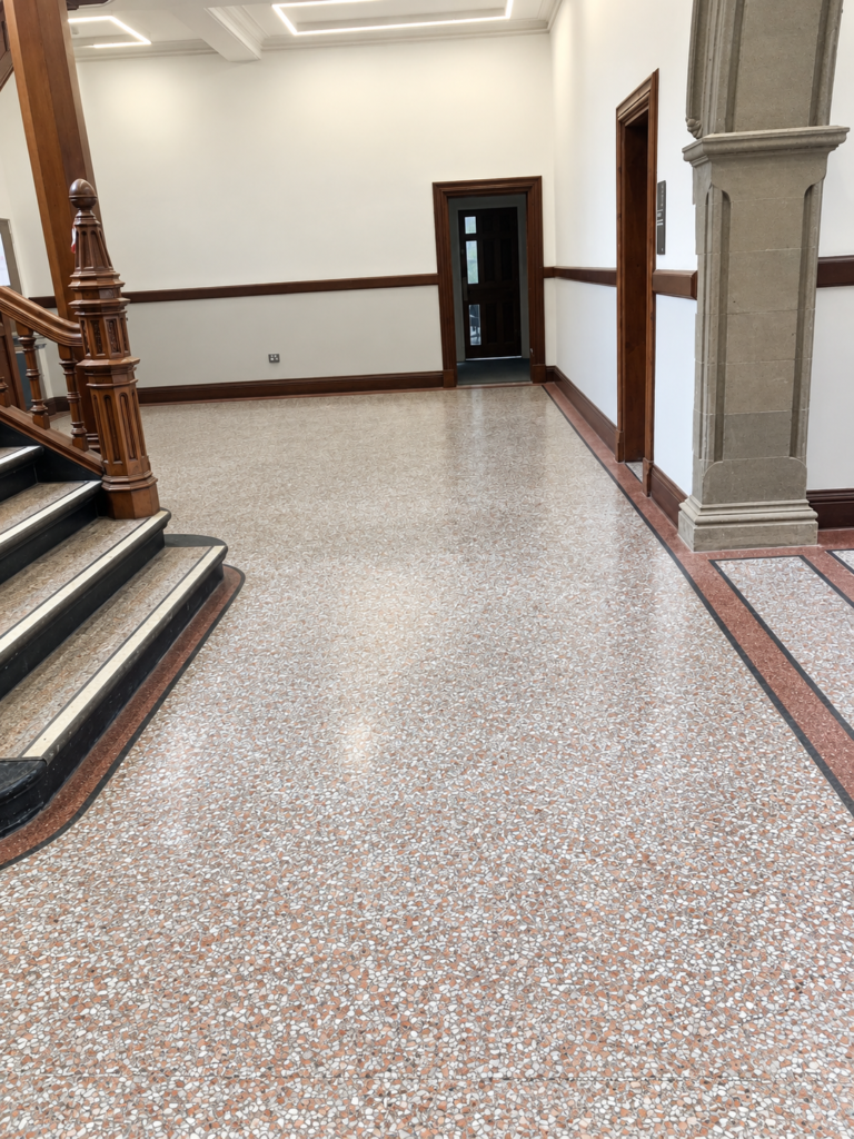 Terrazzo repair and maintenance in a historic building, restoring an original terrazzo floor